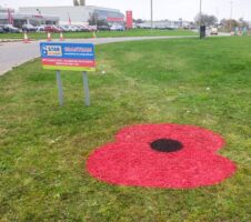 Poppy roundabouts painted for Remembrance Day